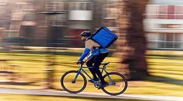 Rider on bike delivering food